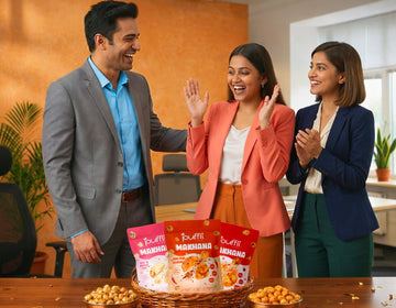 Three people in a casual office setting with Puffli Makhana snacks