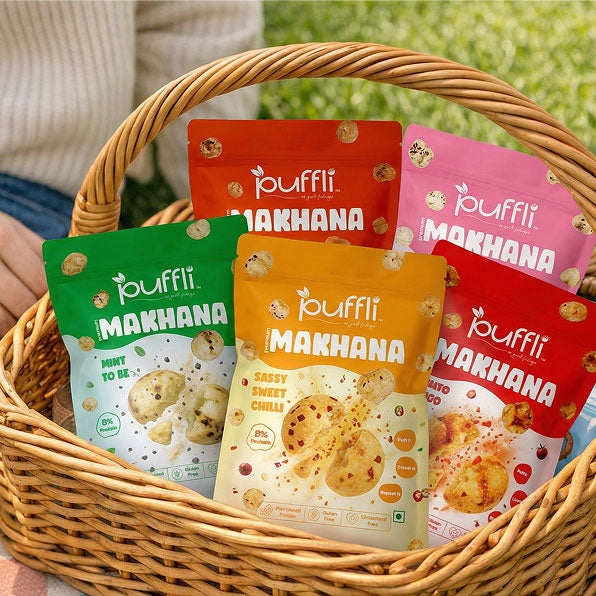 Basket with Puffli Makhana snack packages in various flavors.